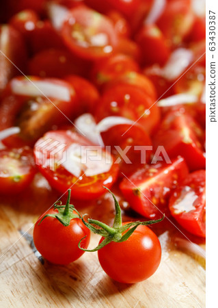 red cherry tomato on wooden background red cherry tomato on wooden background 63430387