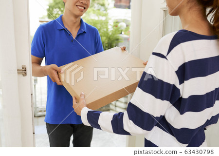 Woman receiving package Woman receiving package 63430798
