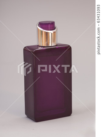 Women's perfume in bottle isolated on gray 63431093