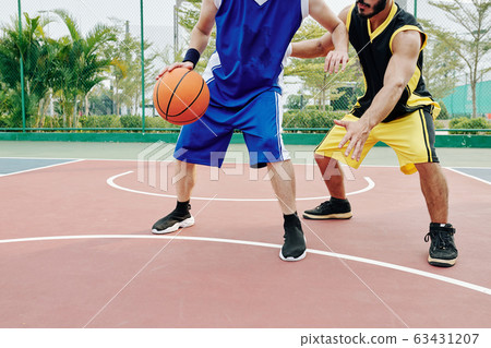 Young men playing basketball Young men playing basketball 63431207