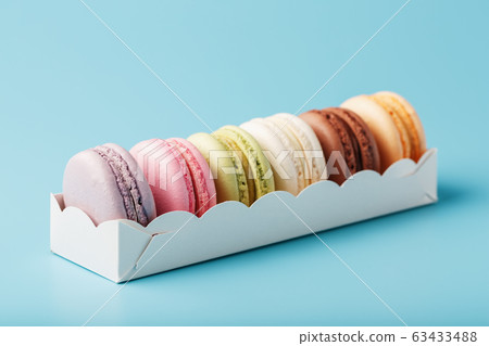 Macaroni cookies of different colors in a white 63433488
