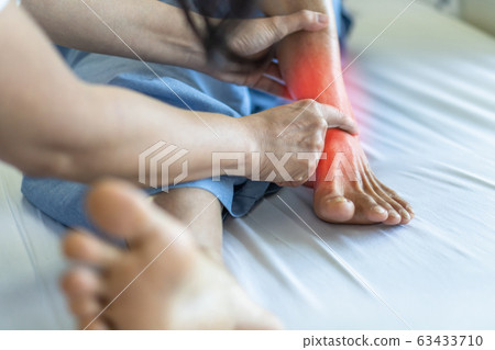 Ankle pain from instability, arthritis, gout, tendonitis, fracture, nerve compression (tarsal tunnel syndrome), infection and poor structural alignment of leg or foot in ageing patient with doctor 63433710