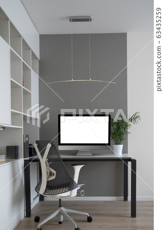 Home working place with modern desk and mock-up computer monitor. 63435259