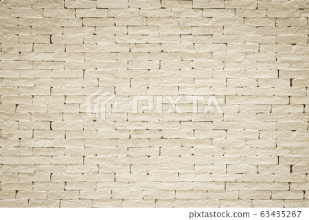 Brick wall pattern texture background painted in light yellow beige color 63435267
