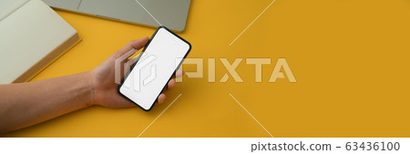Cropped shot of a man holding blank screen 63436100