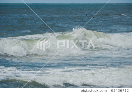 Beach and beautiful views of the cliffs, splashing waves and nature. 63436712