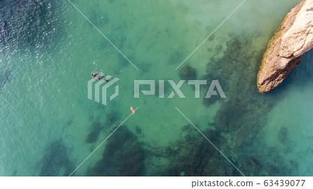 Underwater hunter on the surface of the water while hunting on the Atlantic Sea. Portugal. 63439077
