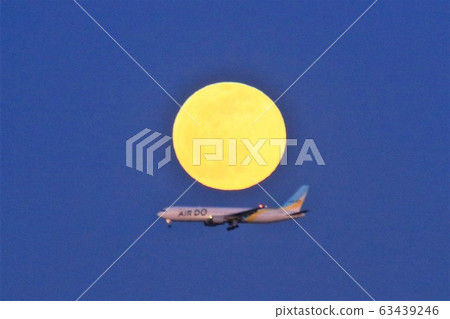 Full moon and airplane AIR DO 63439246