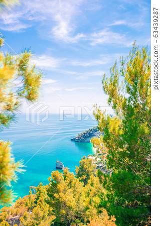 Beautiful cozy bay with boats and clear turquoise water in Italy Beautiful cozy bay with boats and clear turquoise water in Italy 63439287