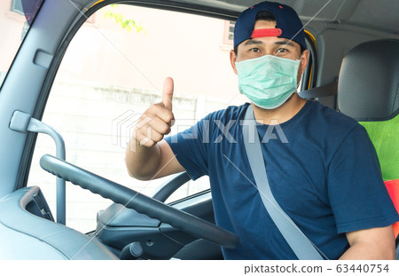 Truck driver wearing a mask 63440754