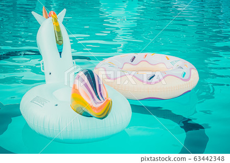Yellow pool float, pool ring in cool blue 63442348