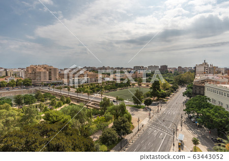 Valencia Turia river park gardens and skyline in Spain Valencia Turia river park gardens and skyline in Spain 63443052