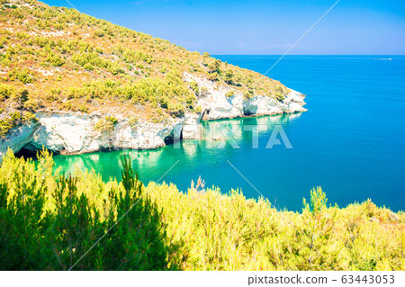 Beautiful cozy bay with boats and clear turquoise water in Italy Beautiful cozy bay with boats and clear turquoise water in Italy 63443053