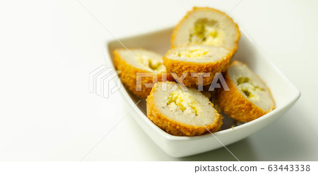 Savory mini scotch eggs in white ceramic bowl, 63443338