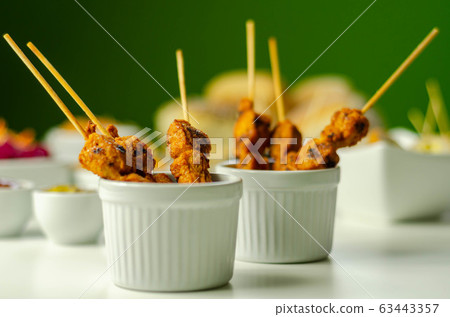 Satay chicken breast marinated in Indonesian style Satay chicken breast marinated in Indonesian style 63443357
