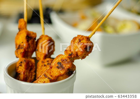 Satay chicken breast marinated in Indonesian style Satay chicken breast marinated in Indonesian style 63443358