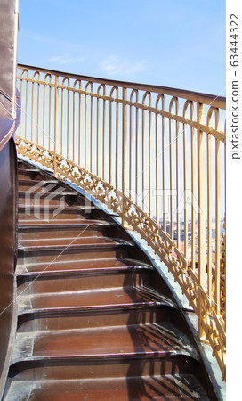 COPENHAGEN, DENMARK - JUL 06th, 2015: External winding staircase to the top of Church of Our Saviour Vor Frelsers Kirke offering extensive views over central Copenhagen COPENHAGEN, DENMARK - JUL 06th, 2015: External winding staircase to the top of Church of Our Saviour Vor Frelsers Kirke offering extensive views over central Copenhagen 63444322