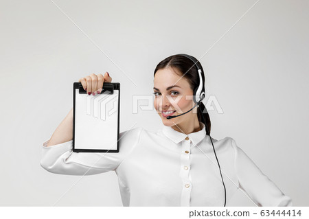 consultant of call center in headphones holding clipboard 63444414