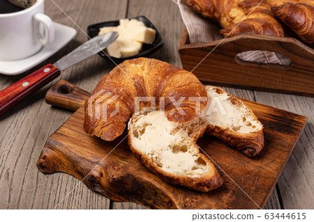 Fresh croissants with butter 63444615