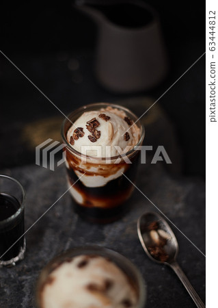 Iced coffee with vanilla ice cream. Iced coffee with vanilla ice cream. 63444812