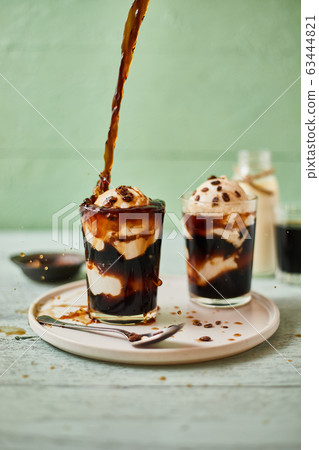 Iced coffee with vanilla ice cream. Iced coffee with vanilla ice cream. 63444821