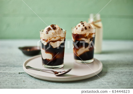 Iced coffee with vanilla ice cream. Iced coffee with vanilla ice cream. 63444823