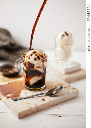 Iced coffee with vanilla ice cream. Iced coffee with vanilla ice cream. 63444824