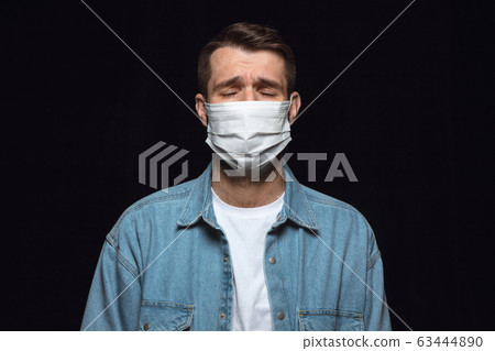 Man in protective mask, coronavirus prevention, protection concept Man in protective mask, coronavirus prevention, protection concept 63444890