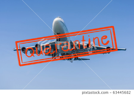Quarantine due to coronavirus epidemic covid19 A white airplane flying in a clear pale blue sky Quarantine due to coronavirus epidemic covid19 A white airplane flying in a clear pale blue sky 63445682