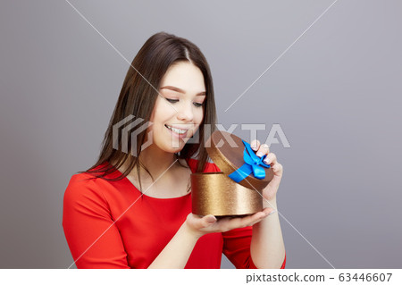 Lovely girl 15-20 years old in a red dress with a Lovely girl 15-20 years old in a red dress with a 63446607