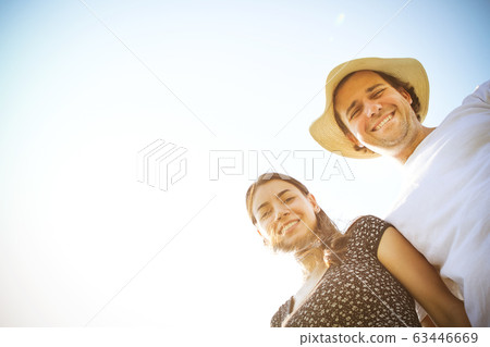 Happy couple enjoying sunny day Happy couple enjoying sunny day 63446669