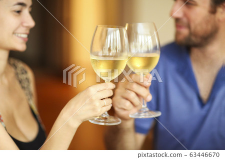 Content couple during dunner in restaurant 63446670
