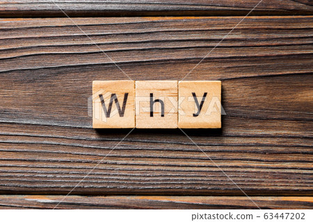 WHY word written on wood block. WHY text on wooden 63447202