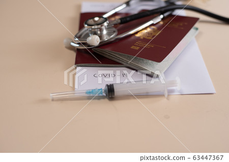 passport on background, health and prevention coronavirus, medicine, migration 63447367