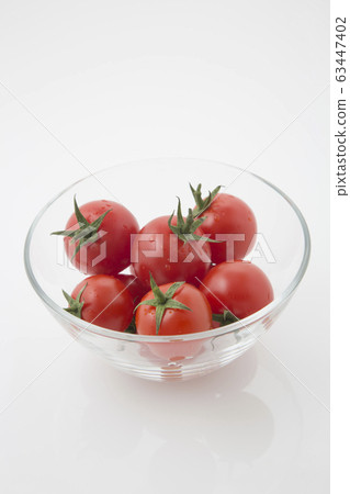 High angle with glass ball with tomato water drop High angle with glass ball with tomato water drop 63447402