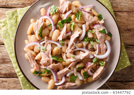 Hearty homemade salad with tuna, onions and white 63447792