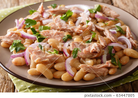 Hearty homemade salad with tuna, onions Hearty homemade salad with tuna, onions 63447805