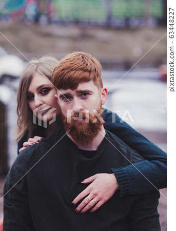 woman hugging handsome red head man woman hugging handsome red head man 63448227