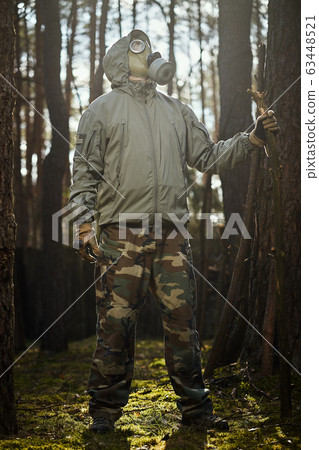 man in a gas mask protects himself from coronavirus man in a gas mask protects himself from coronavirus 63448521