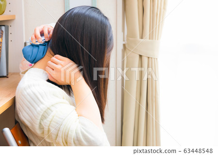 Woman cooling her neck with ice cubes copy space 63448548
