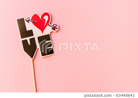 Photo booth props isolated on pink background. Top view. Photo booth props isolated on pink background. Top view. 63448641