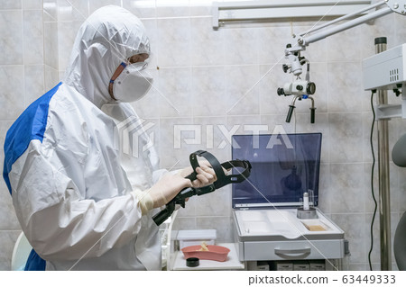 Doctor in protective suit at pandemic period. 63449333