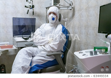 Doctor in protective suit at pandemic period. 63449334
