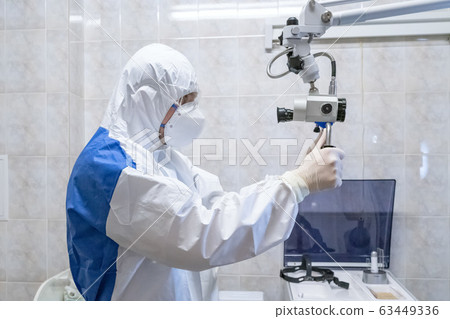 Doctor in protective suit at pandemic period. 63449336