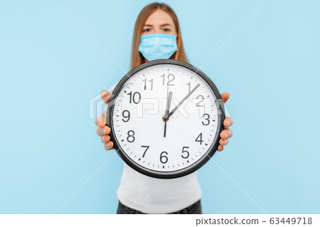 woman wearing a protective medical mask against 63449718