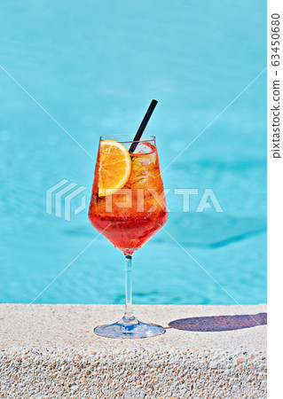 Wine Glass of cold cocktail Aperol spritz against Wine Glass of cold cocktail Aperol spritz against 63450680