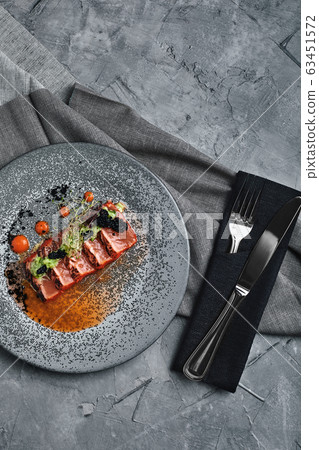 grilled salmon tagliata top view, beautiful table setting, Beautiful serving, traditional italian food, gray background, copy space. food concept 63451572