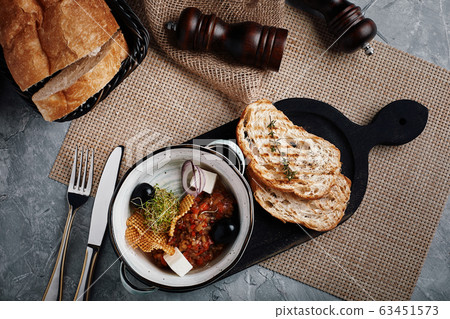 vegetable stew. top view, beautiful table setting, beautiful serving, traditional italian food, gray background, copy space. food concept 63451573