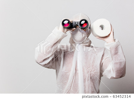 Young doctor in protection suit and glasses with 63452314