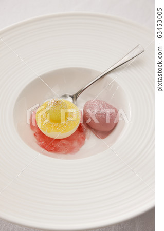 Ice cream dessert on white plate 63453005